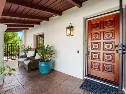 a view of front door with outdoor seating