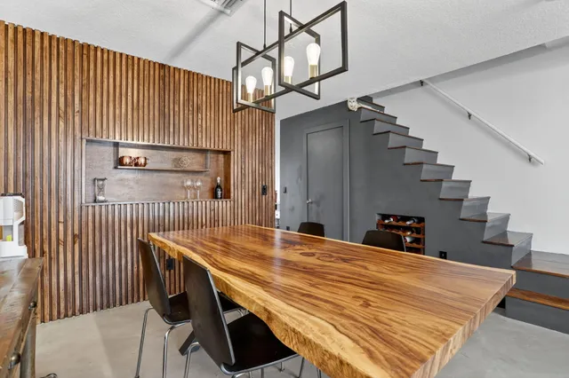 a dining room with a table and chairs