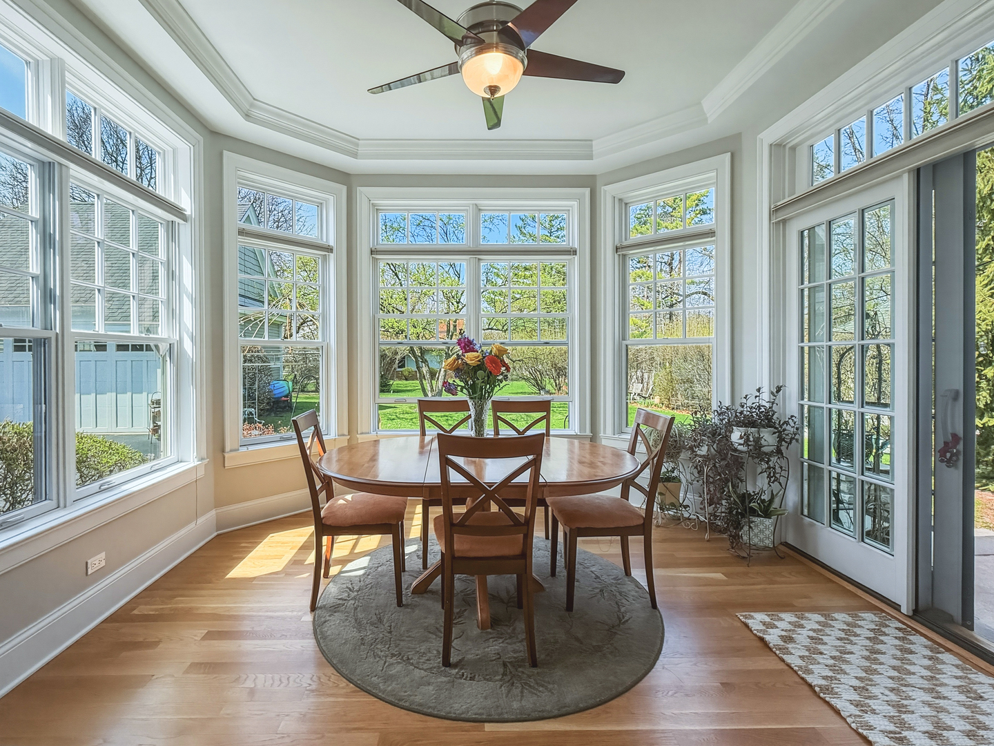 780 Prairie Road Glencoe, IL 60022 - Photo 6 of 30 a dining room with furniture a rug and a large window