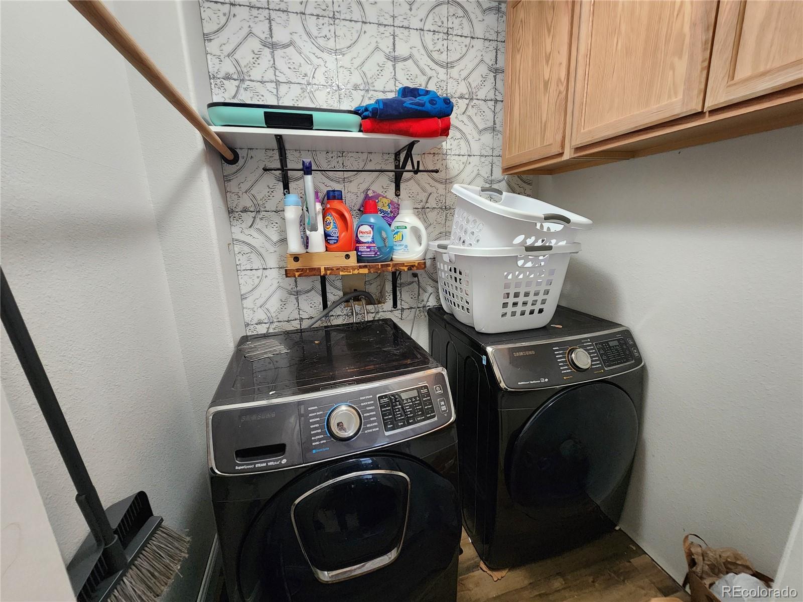 4745 Purcell Drive Colorado Springs, CO 80922 - Photo 14 of 25 a storage and utility room with washer and dryer