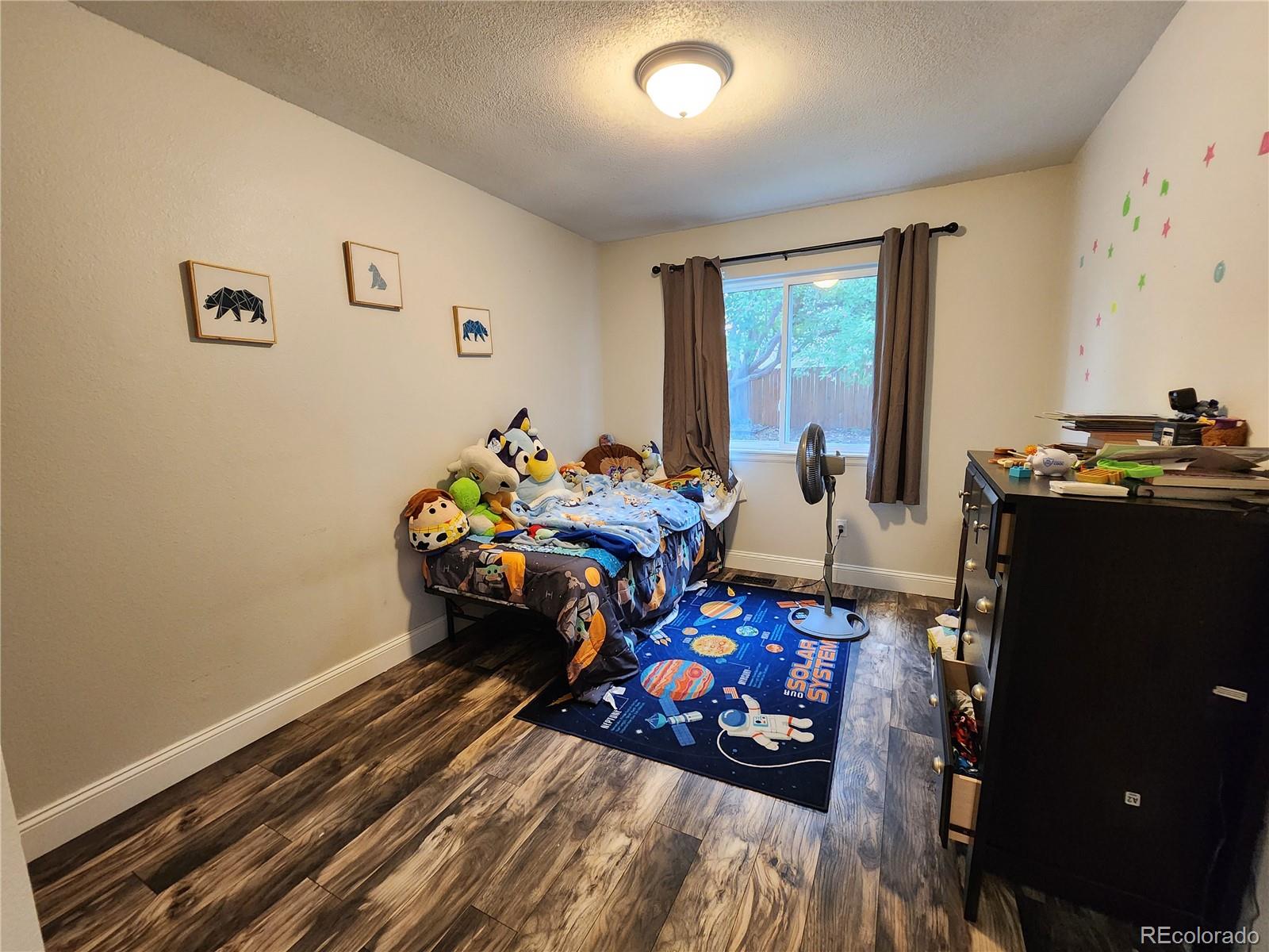 4745 Purcell Drive Colorado Springs, CO 80922 - Photo 15 of 25 a bedroom with furniture and a window