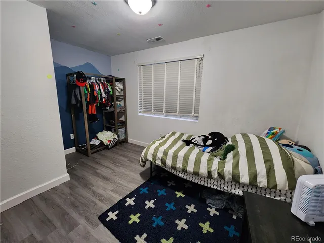 a bathroom with a sink a toilet and shower curtain