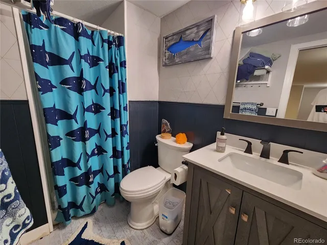 a bedroom with bed and a window