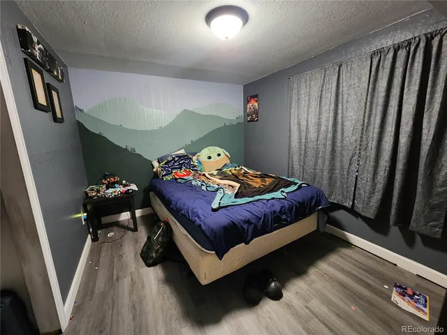 a view of a yard with wooden fence