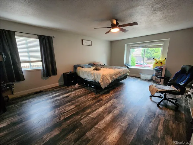 a bed room with furniture and a window