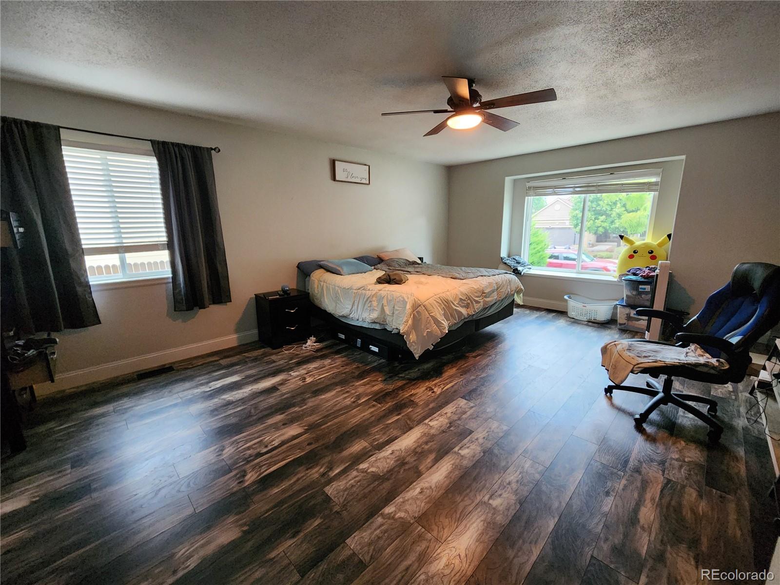 4745 Purcell Drive Colorado Springs, CO 80922 - Photo 8 of 25 a bed room with furniture and a window