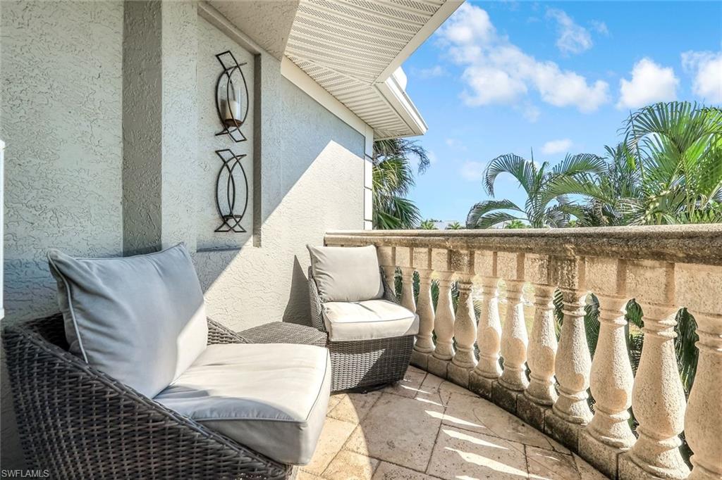 993 8th Street South, Unit 2 Naples, FL 34102 - Photo 12 of 28 a living room with furniture and a floor to ceiling window