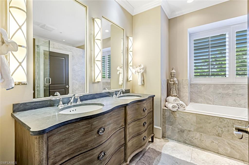 993 8th Street South, Unit 2 Naples, FL 34102 - Photo 13 of 28 a bathroom with a granite countertop sink and a mirror