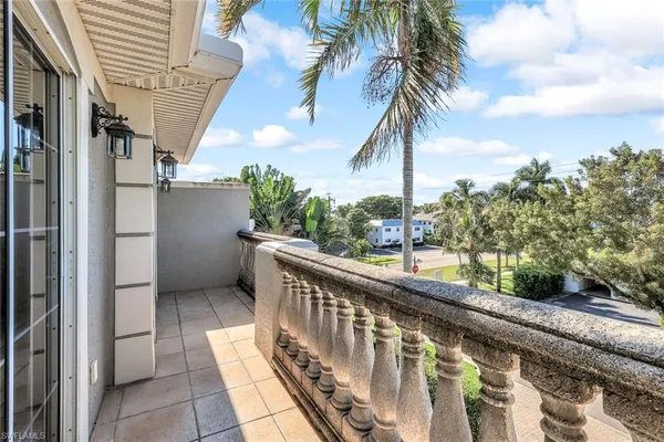 a view of balcony with furniture