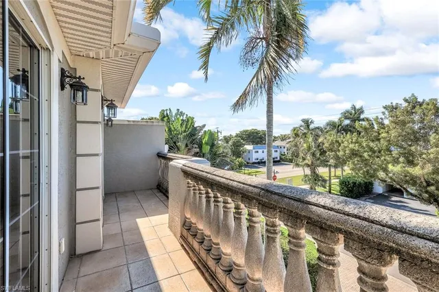 a view of balcony with furniture