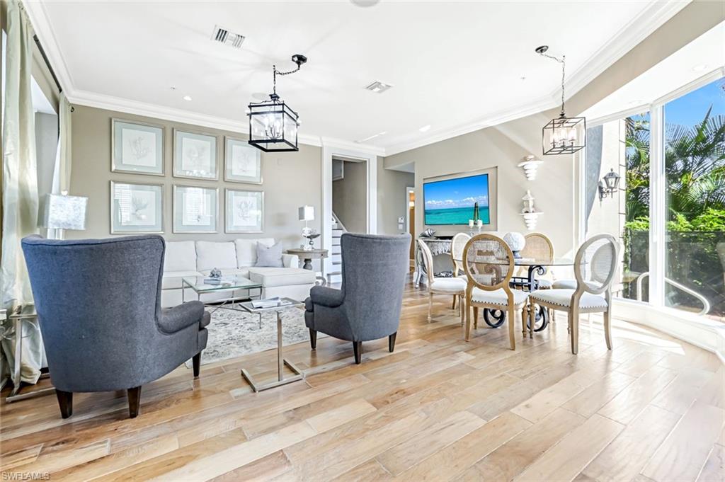 993 8th Street South, Unit 2 Naples, FL 34102 - Photo 6 of 28 a view of a dining room with furniture window and outside view