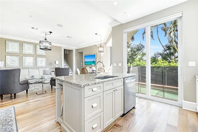 a kitchen with counter top space and sink