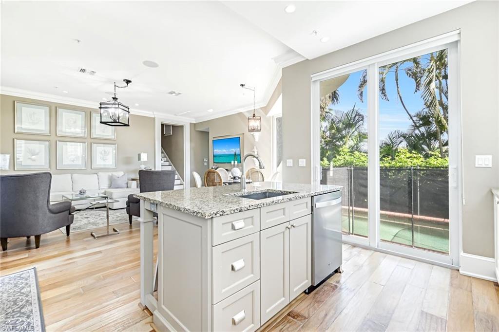 993 8th Street South, Unit 2 Naples, FL 34102 - Photo 9 of 28 a kitchen with counter top space and sink