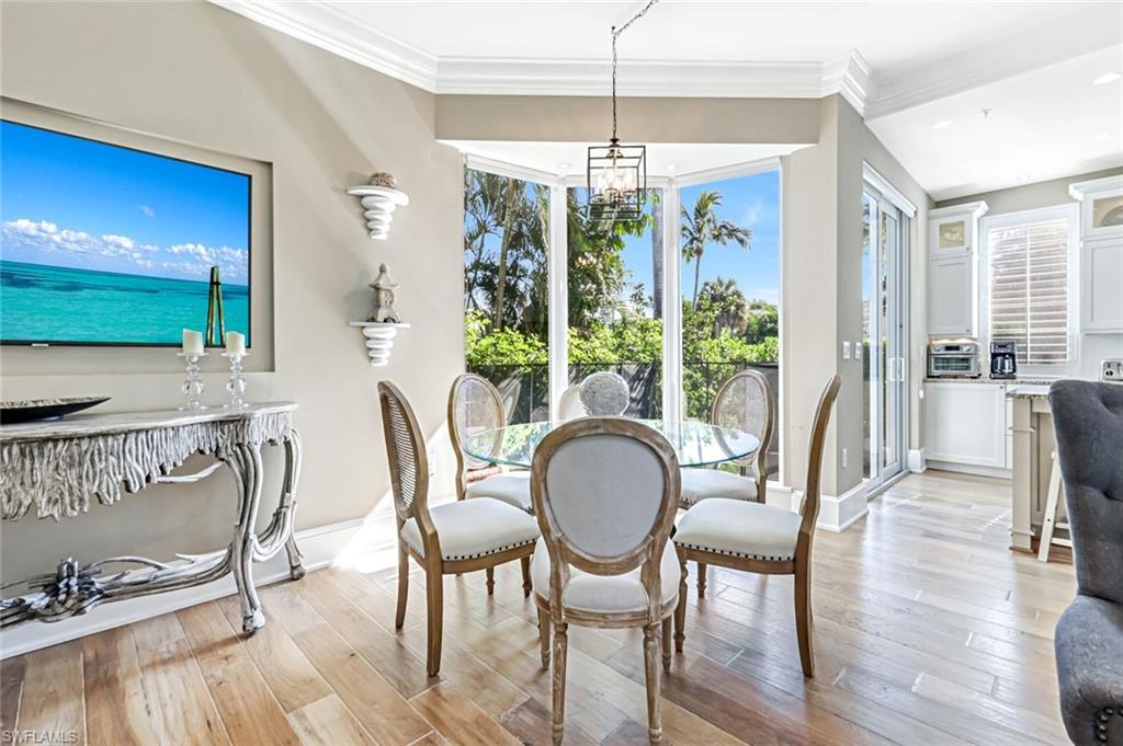 993 8th Street South, Unit 2 Naples, FL 34102 - Photo 10 of 28 a view of a dining room with furniture window and outside view