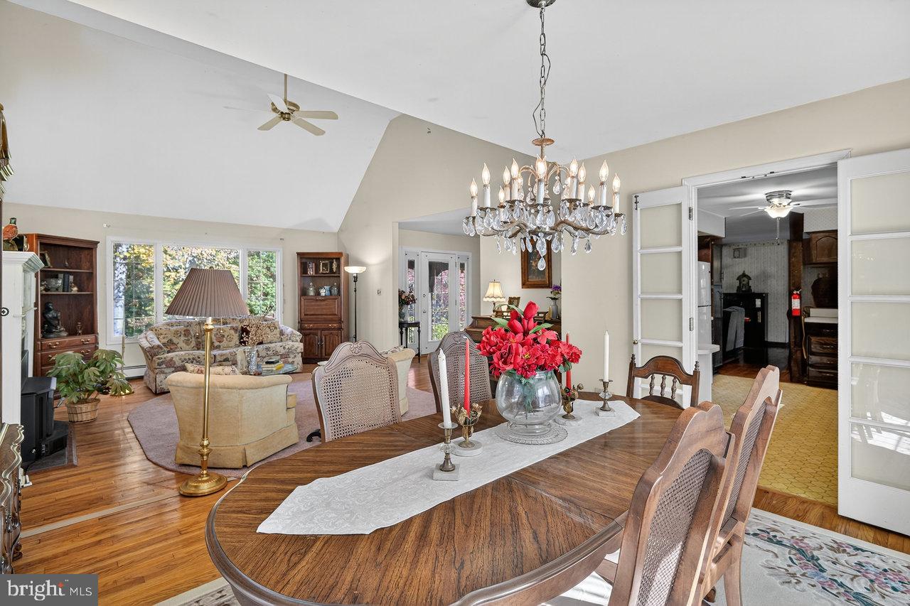 229 Lambertville Headquarters Road Stockton, NJ 08559 - Photo 15 of 44 a dining room with furniture a chandelier and wooden floor