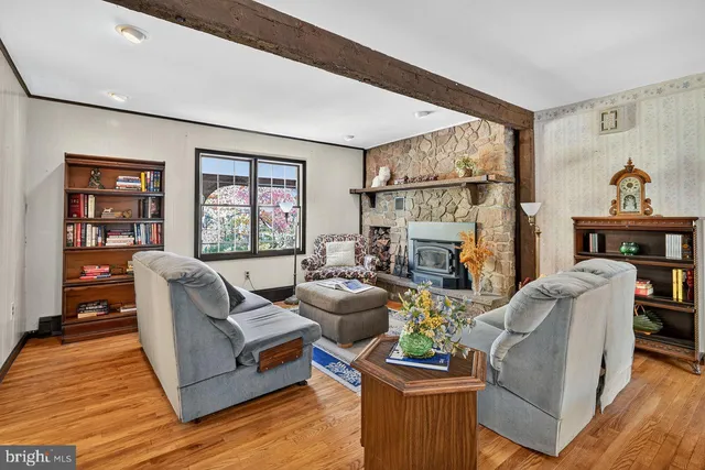 a living room with furniture window and wooden floor