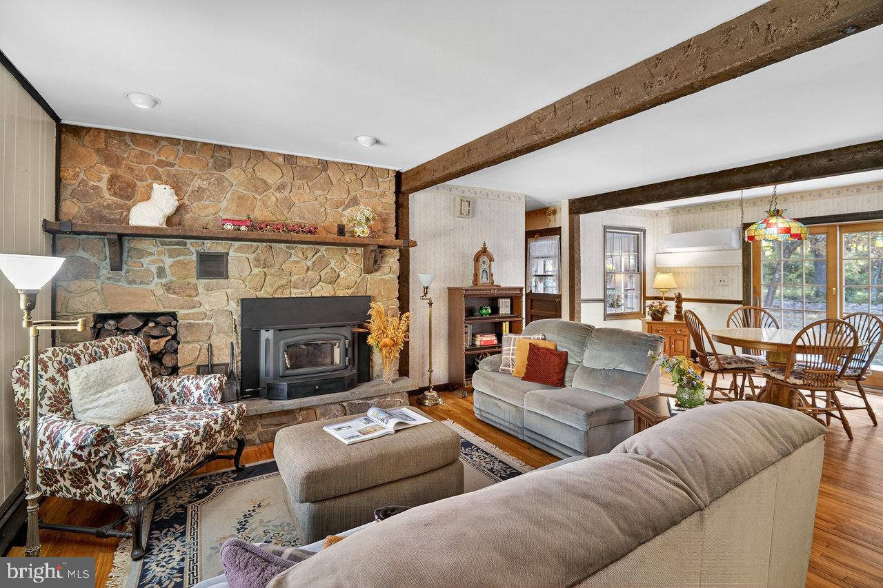 229 Lambertville Headquarters Road Stockton, NJ 08559 - Photo 20 of 44 a living room with furniture and a fireplace