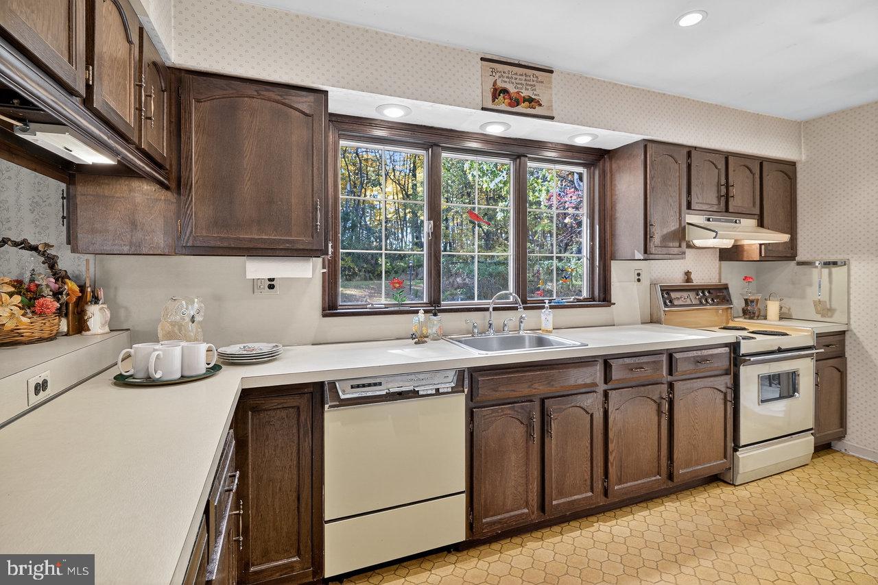 229 Lambertville Headquarters Road Stockton, NJ 08559 - Photo 23 of 44 a kitchen with a sink stove and cabinets