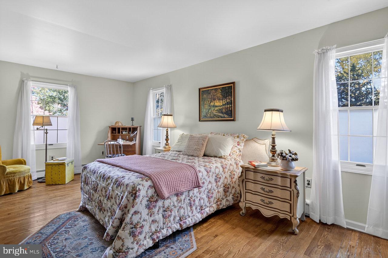 229 Lambertville Headquarters Road Stockton, NJ 08559 - Photo 29 of 44 a bedroom with a bed and wooden floor