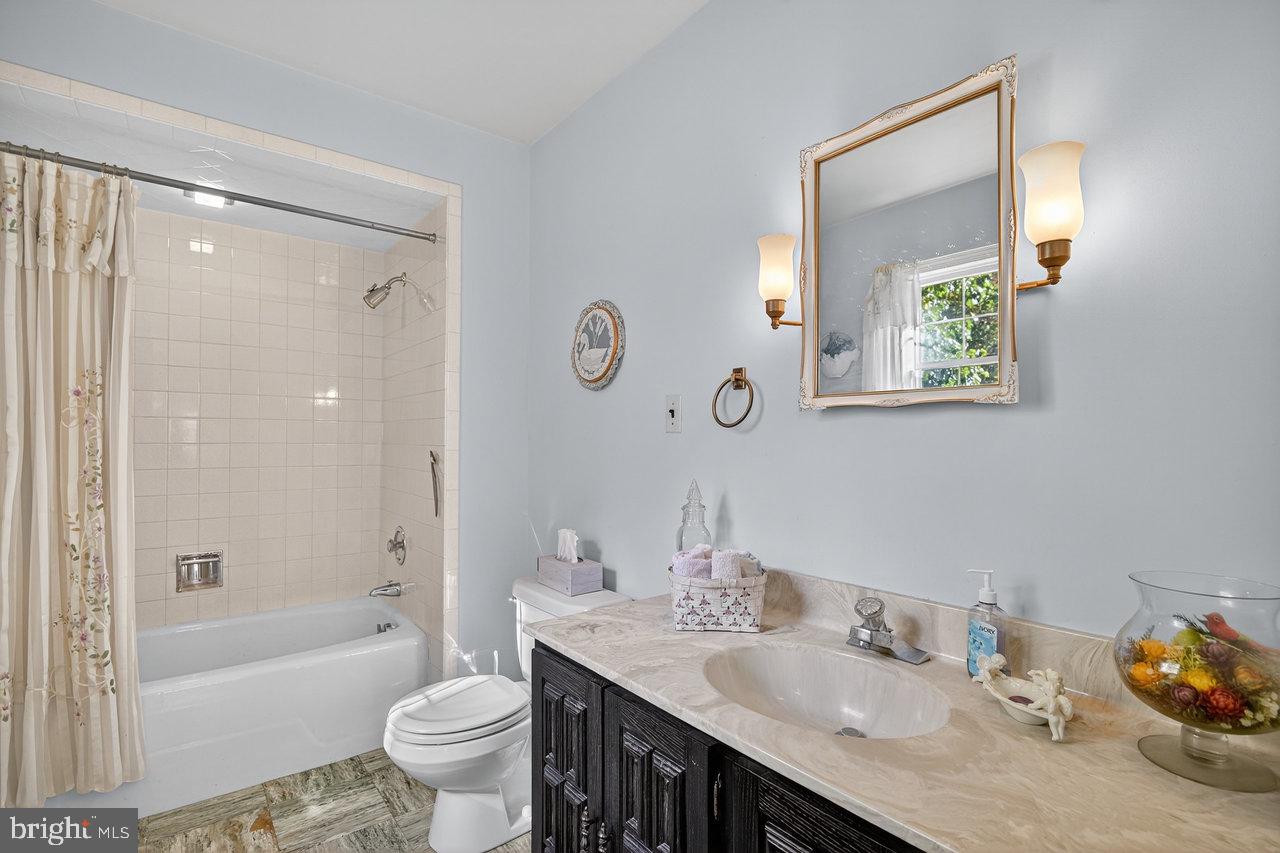 229 Lambertville Headquarters Road Stockton, NJ 08559 - Photo 30 of 44 a bathroom with a granite countertop sink toilet and shower