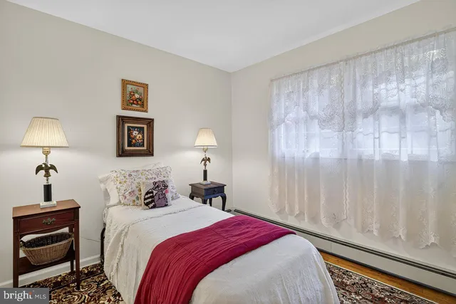 a bedroom with a bed and a table