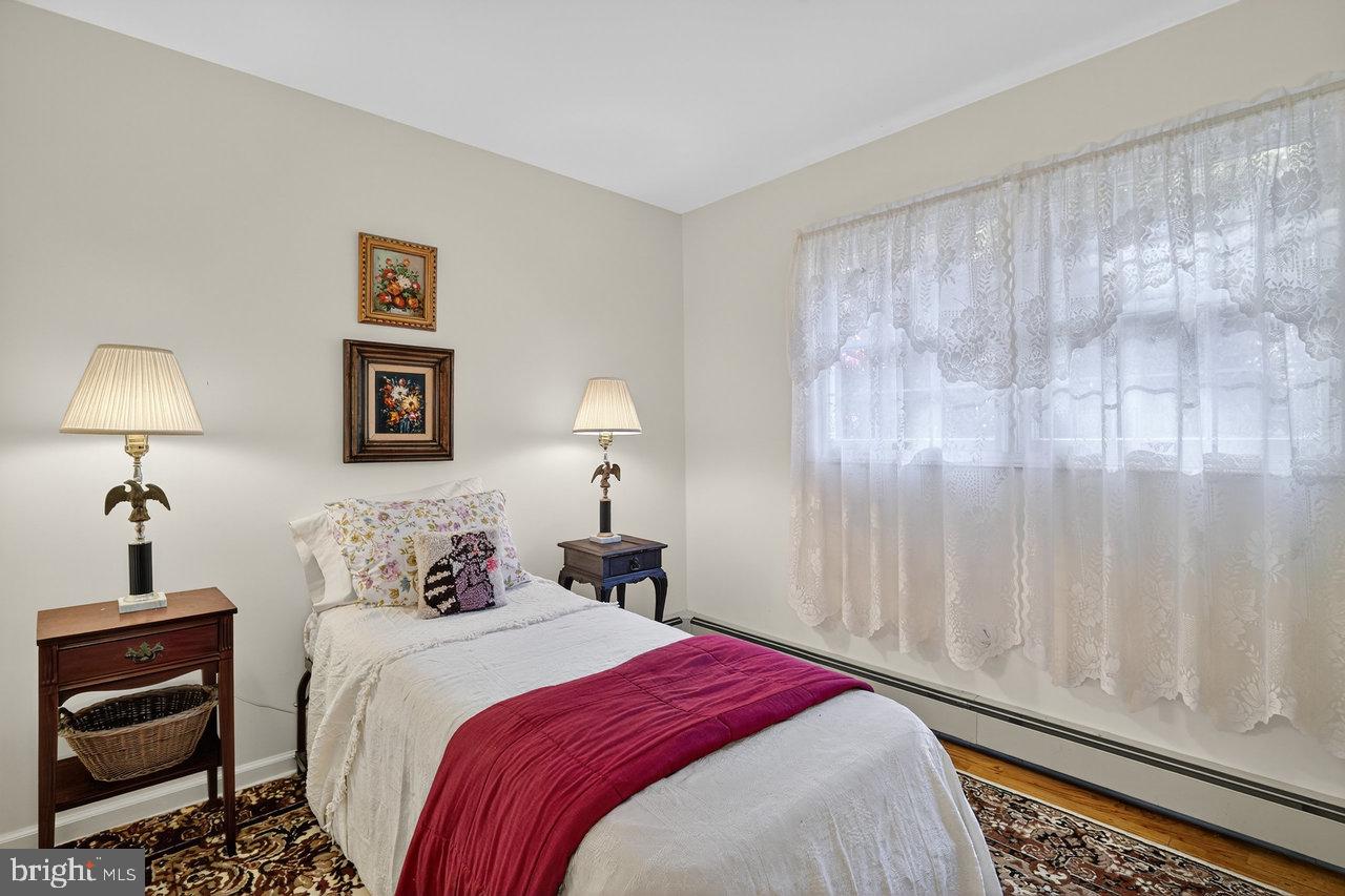 229 Lambertville Headquarters Road Stockton, NJ 08559 - Photo 31 of 44 a bedroom with a bed and a night stand