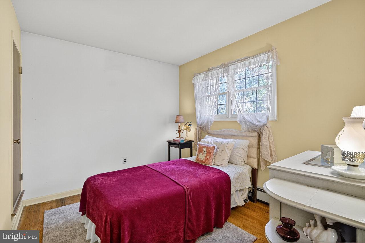 229 Lambertville Headquarters Road Stockton, NJ 08559 - Photo 32 of 44 a bedroom with a bed and a table