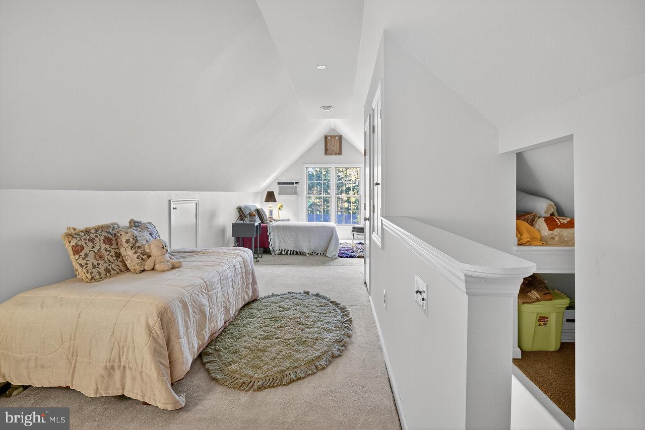 229 Lambertville Headquarters Road Stockton, NJ 08559 - Photo 34 of 44 a bedroom with a bed and a couch