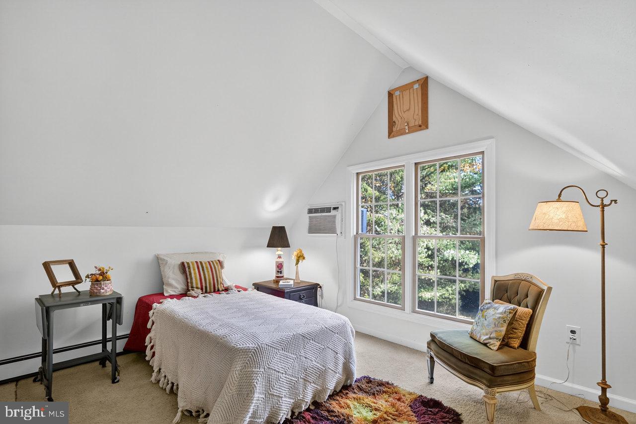 229 Lambertville Headquarters Road Stockton, NJ 08559 - Photo 35 of 44 a bedroom with a bed and wooden floor