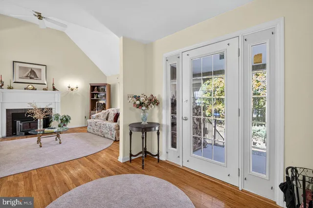a bedroom with furniture and a wooden floor