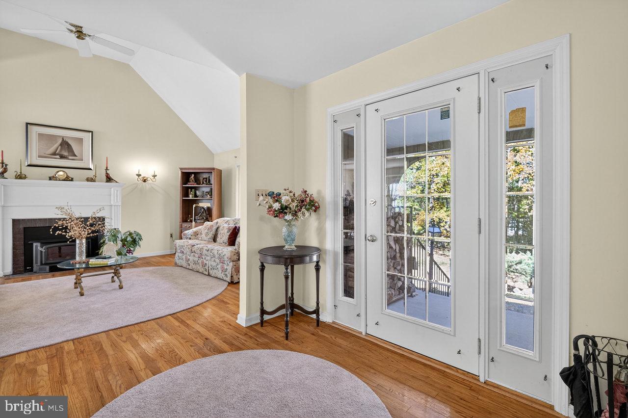 229 Lambertville Headquarters Road Stockton, NJ 08559 - Photo 8 of 44 a living room with furniture a fireplace and a table