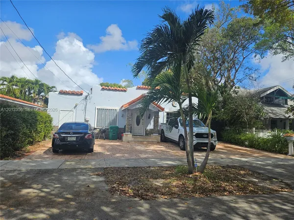 a car parked in front of a house