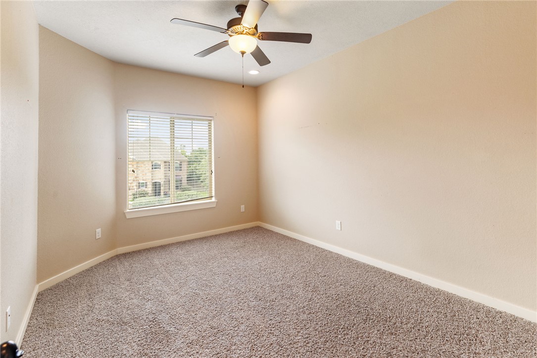 2136 Rockcliffe Loop College Station, TX 77845 - Photo 36 of 48 an empty room with windows and fan