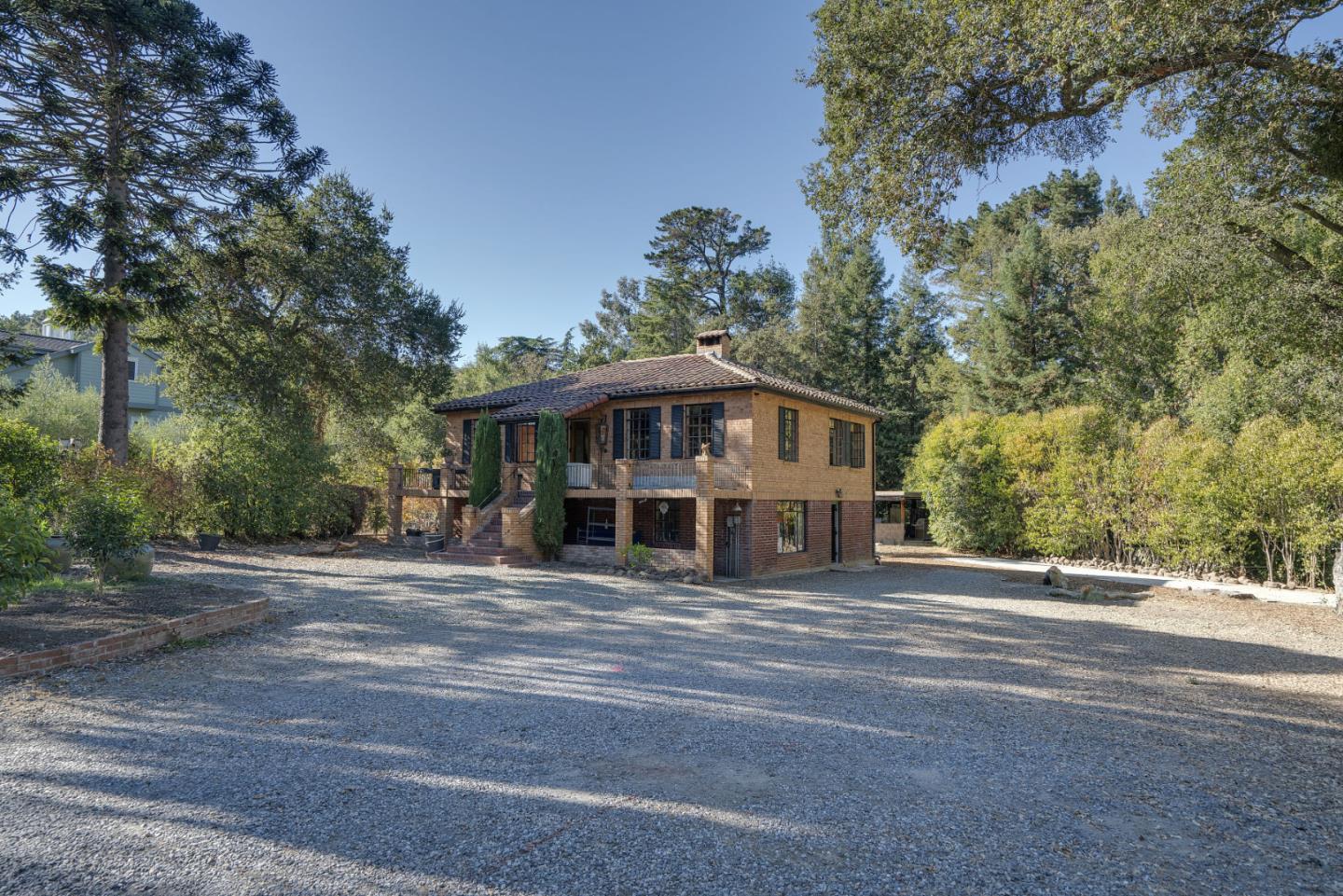 1438 Edgewood Road Redwood City, CA 94062 - Photo 1 of 9 a view of a house with a large trees