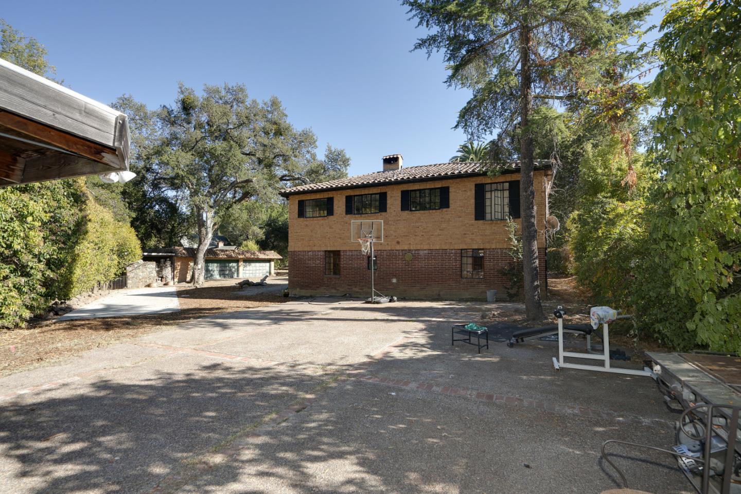 1438 Edgewood Road Redwood City, CA 94062 - Photo 3 of 9 a front view of a house with a yard