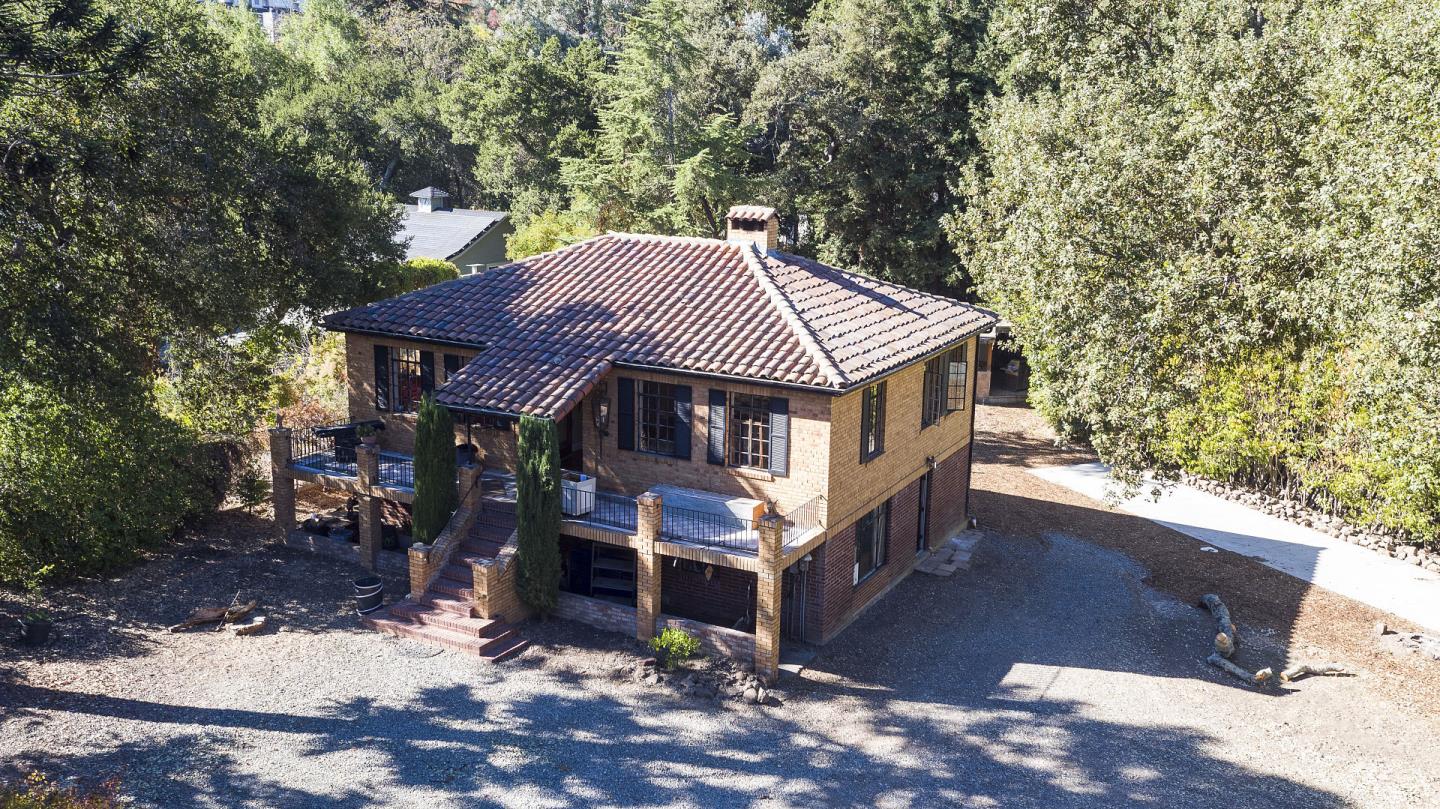 1438 Edgewood Road Redwood City, CA 94062 - Photo 6 of 9 a front view of a house with a yard