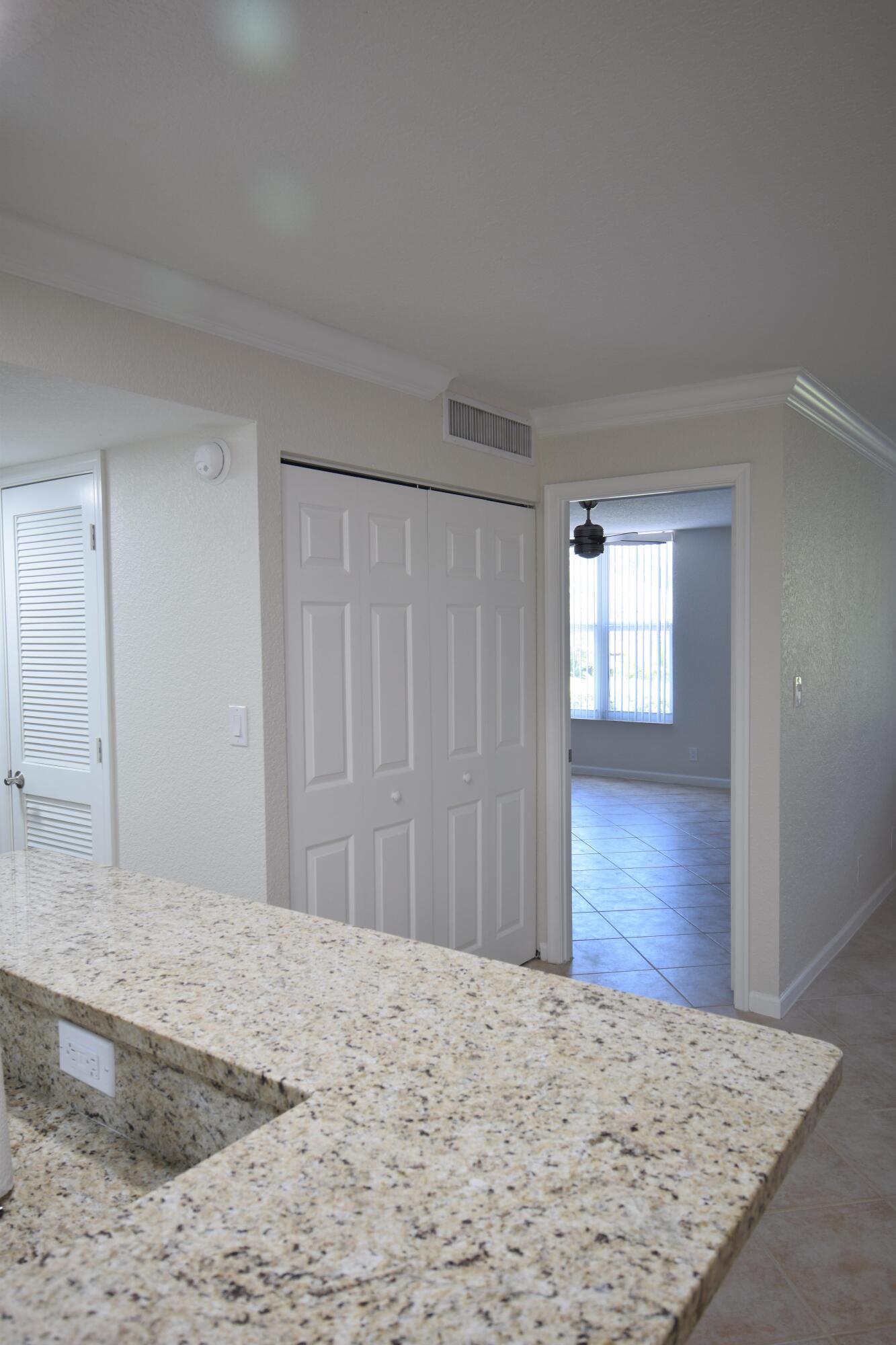 1000 Spanish River Road, Unit 2K Boca Raton, FL 33432 - Photo 17 of 26 a view of a livingroom with wooden floor and cabinet