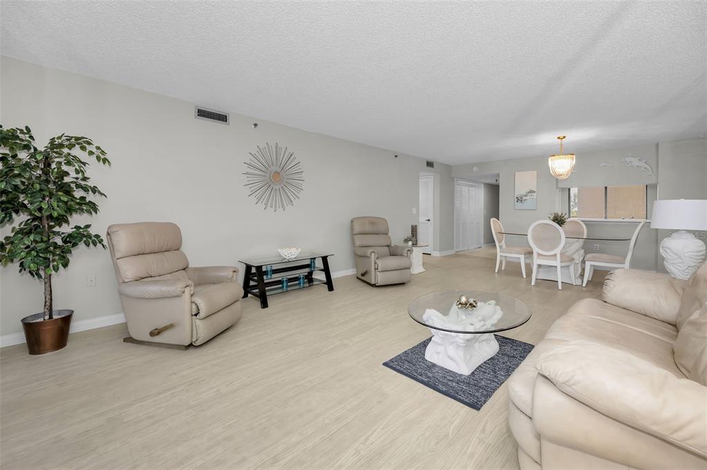 19111 Vista Bay Drive, Unit 211 Indian Shores, FL 33785 - Photo 14 of 62 a living room with furniture and flowers