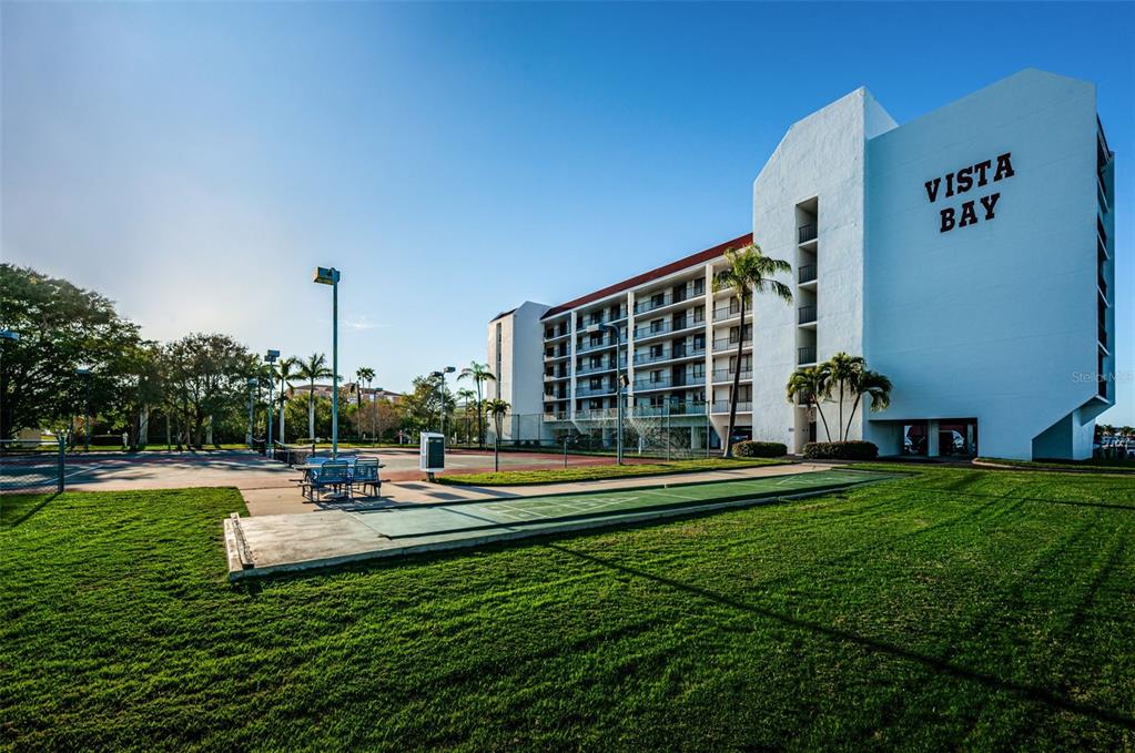 19111 Vista Bay Drive, Unit 211 Indian Shores, FL 33785 - Photo 2 of 62 a view of a building with garden