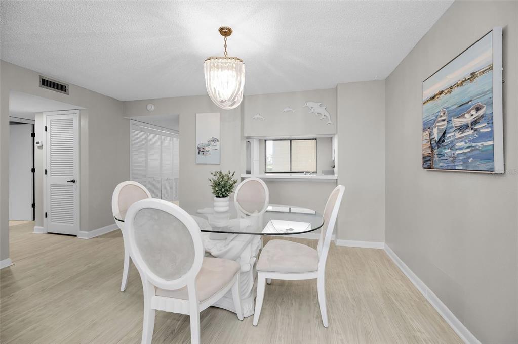 19111 Vista Bay Drive, Unit 211 Indian Shores, FL 33785 - Photo 22 of 62 a dining room with furniture and window