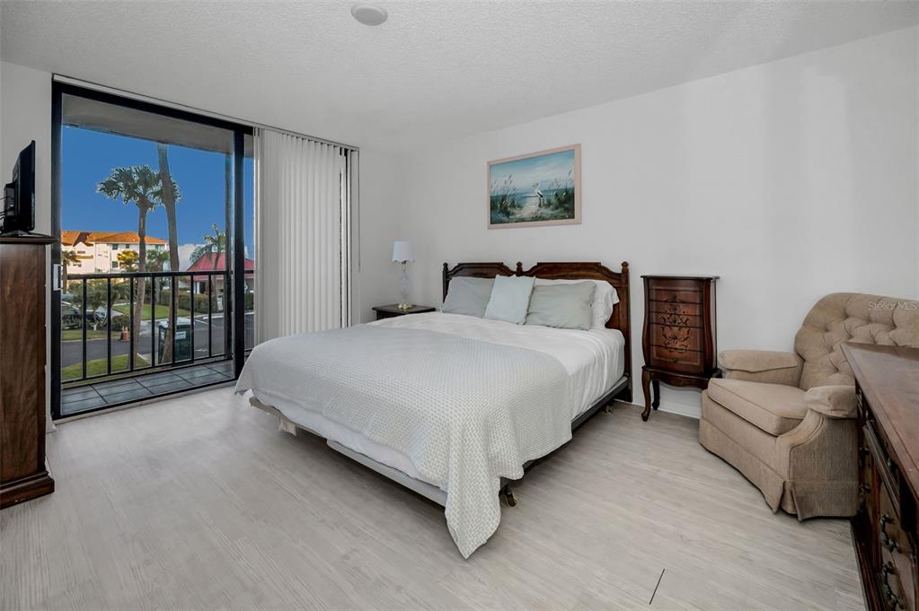 19111 Vista Bay Drive, Unit 211 Indian Shores, FL 33785 - Photo 28 of 62 a bedroom with a bed and a couch