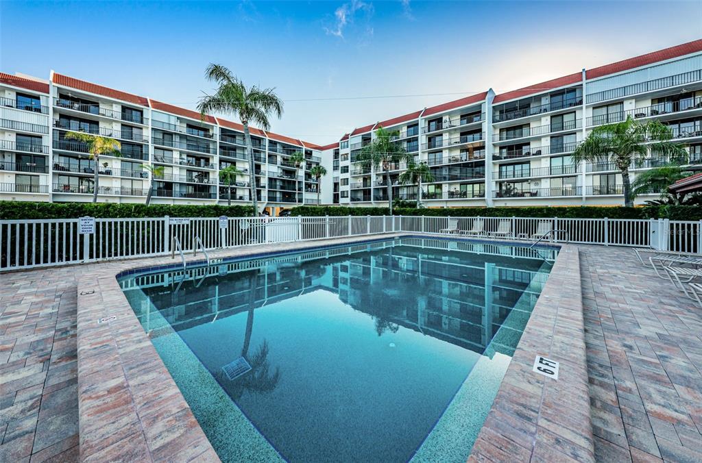 19111 Vista Bay Drive, Unit 211 Indian Shores, FL 33785 - Photo 49 of 62 a view of swimming pool from a balcony