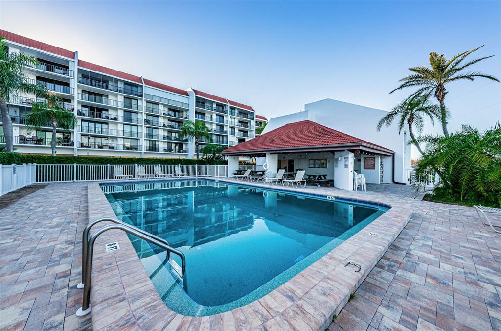 19111 Vista Bay Drive, Unit 211 Indian Shores, FL 33785 - Photo 50 of 62 a view of swimming pool with outdoor seating and deck