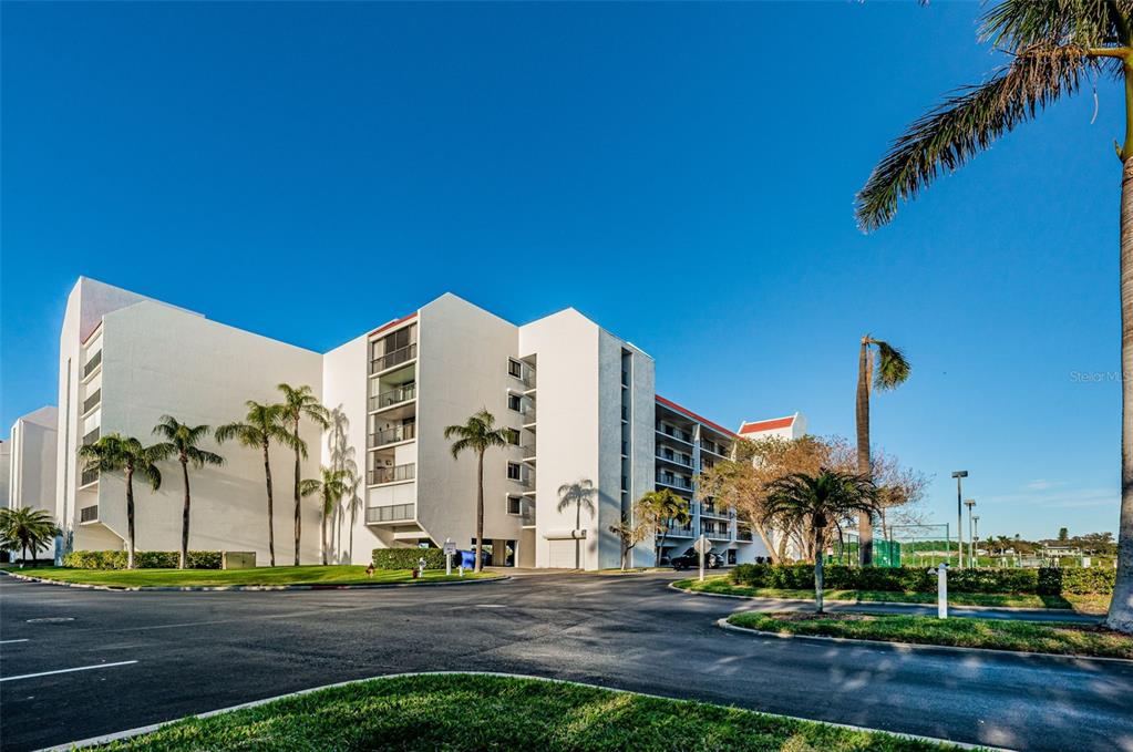 19111 Vista Bay Drive, Unit 211 Indian Shores, FL 33785 - Photo 5 of 62 a view of a building and yard