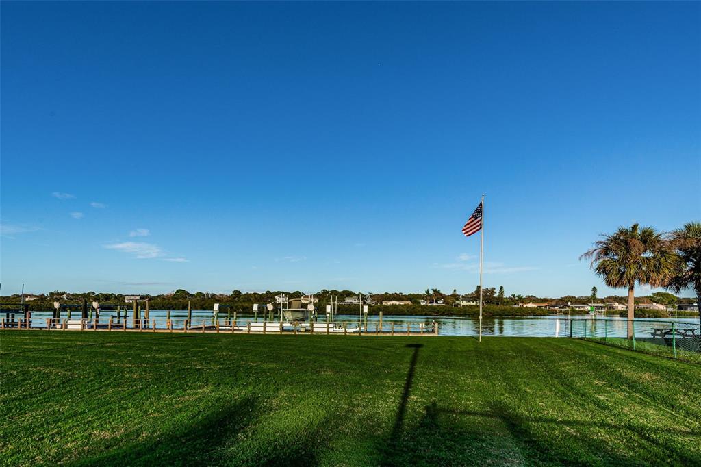 19111 Vista Bay Drive, Unit 211 Indian Shores, FL 33785 - Photo 56 of 62 a view of a field with a grassy area
