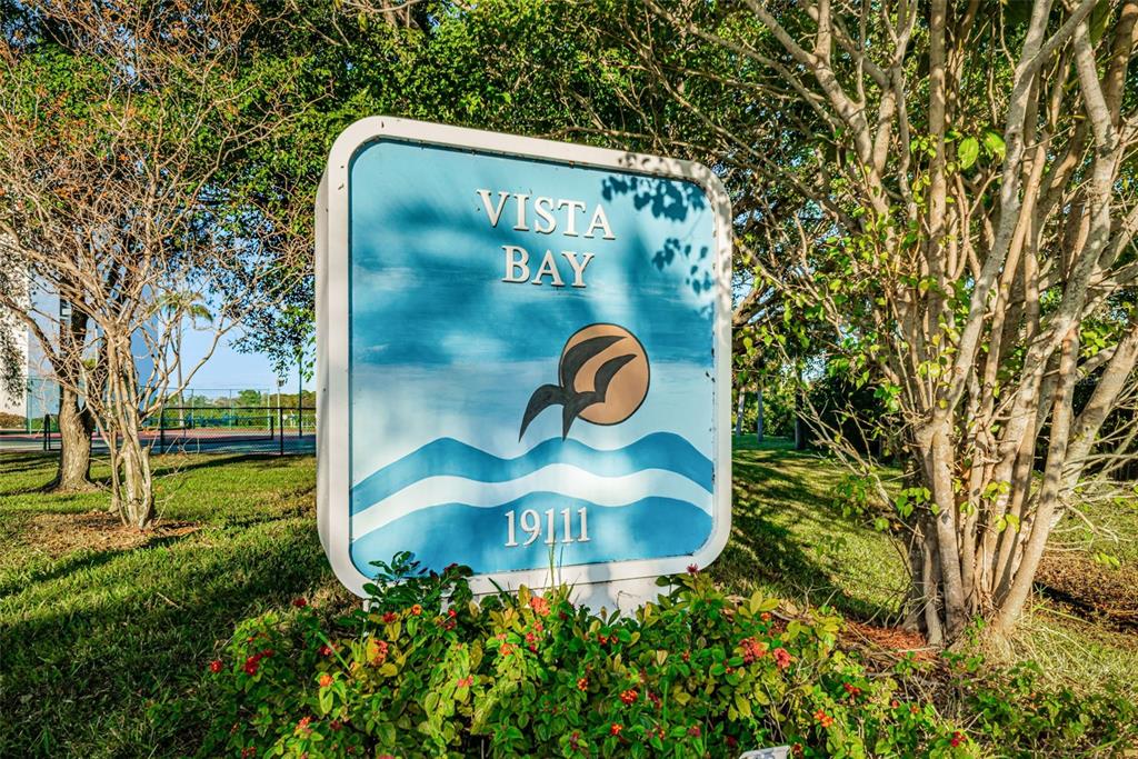 19111 Vista Bay Drive, Unit 211 Indian Shores, FL 33785 - Photo 62 of 62 a view of a sign in a yard