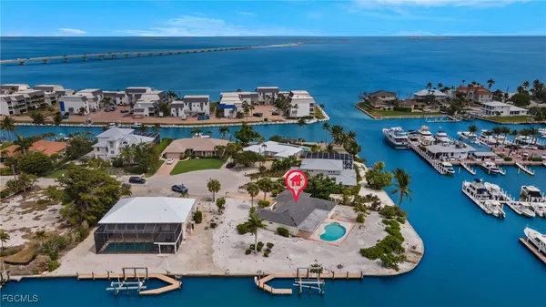 an aerial view of a house with a ocean view
