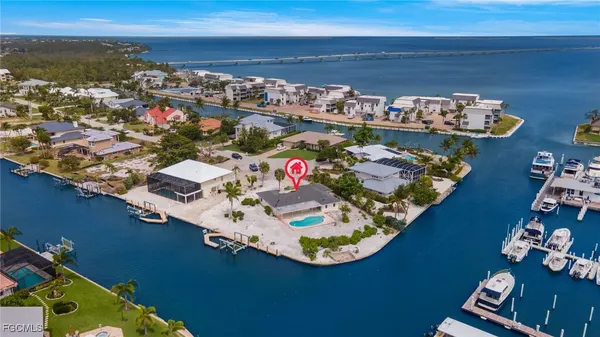 an aerial view of a house with a ocean view