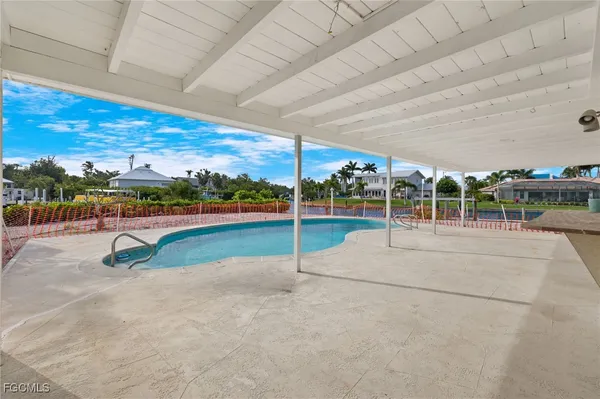 a view of a swimming pool with a patio