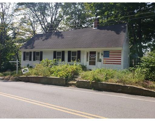 13 Pepperell Road Groton, MA 01450 - Photo 1 of 2 a front view of a house with a garden